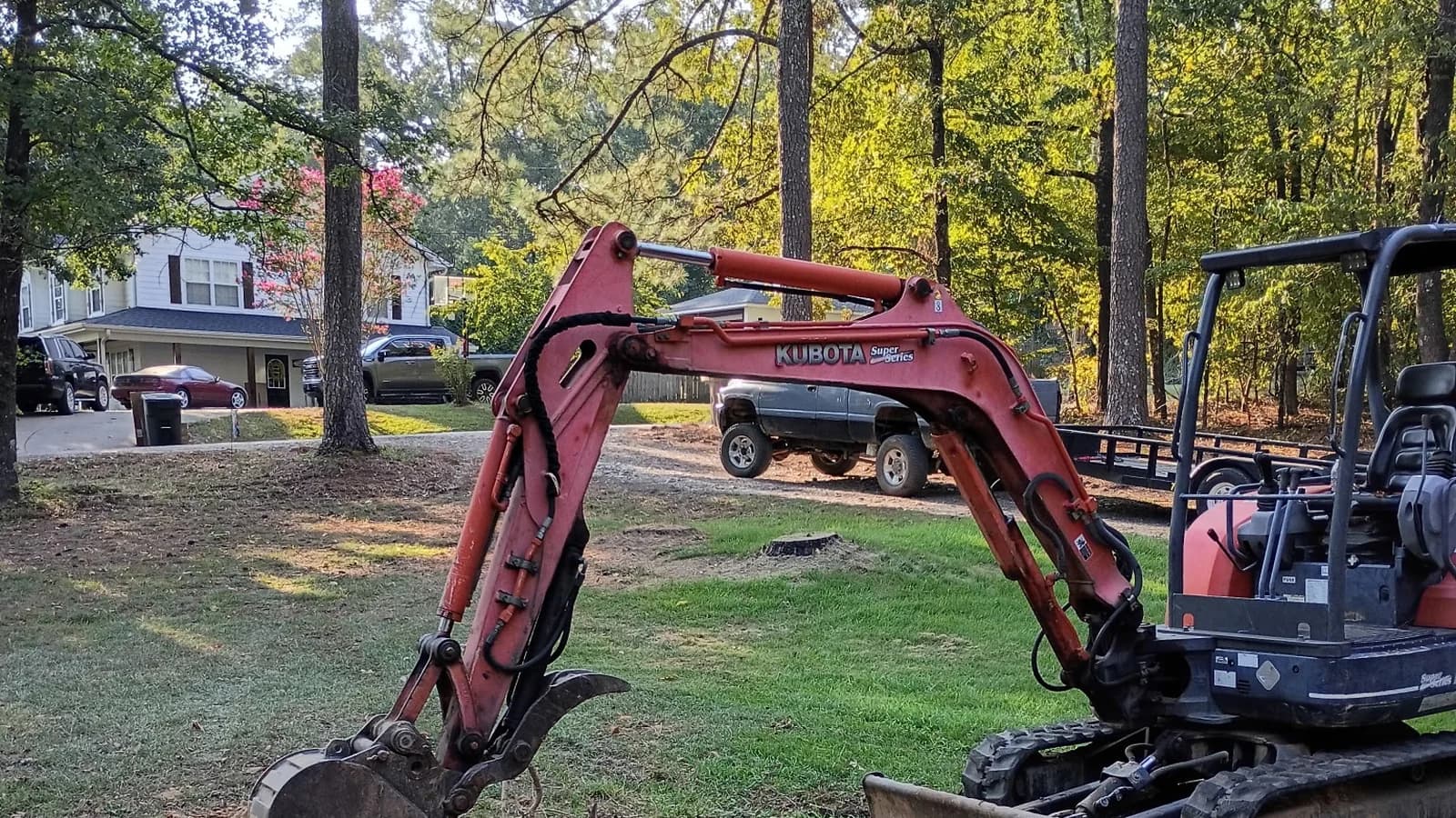 Red Dirt mini excavator doing dirt and excavation work on an Arkansas property