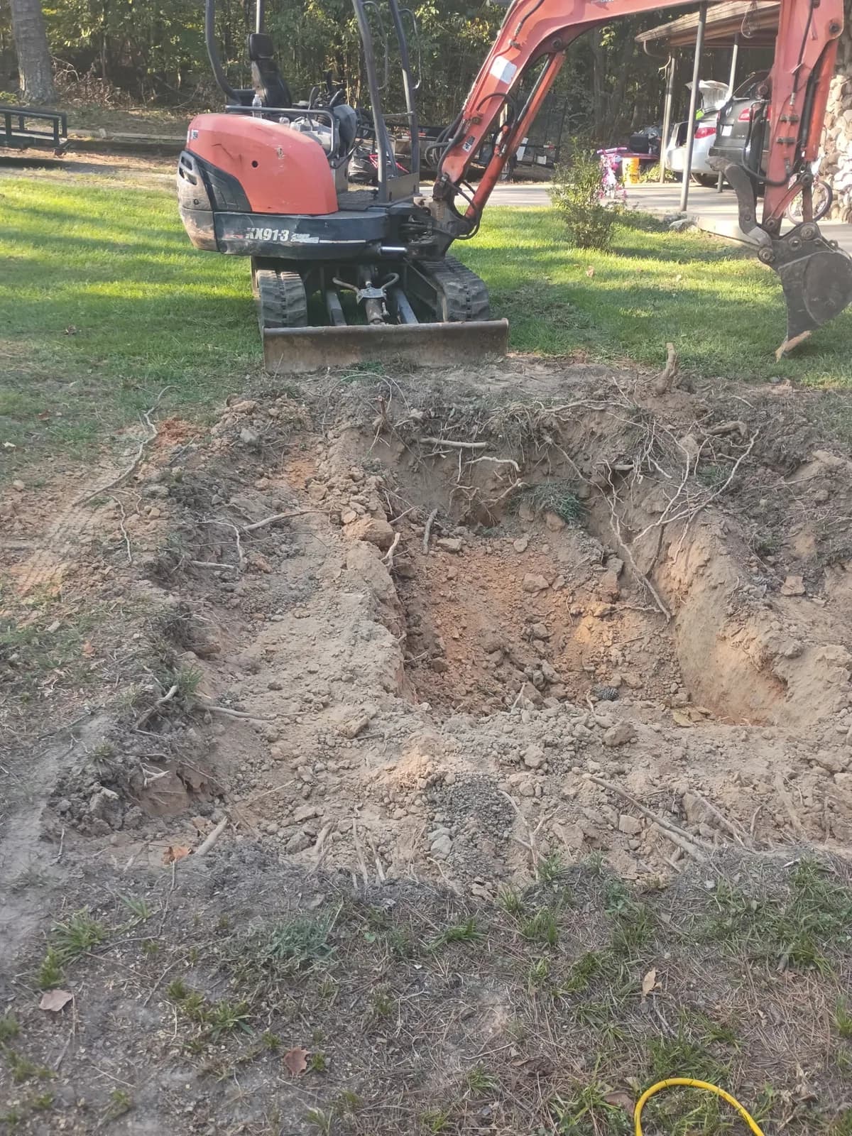Excavated area after root and stump removal work